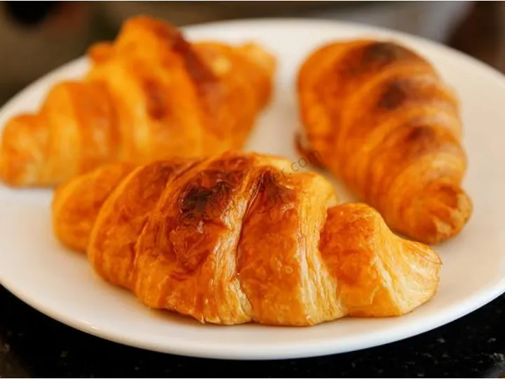 Golden crispy puff pastry layers made with dough sheeter, perfect flaky texture for bakeries